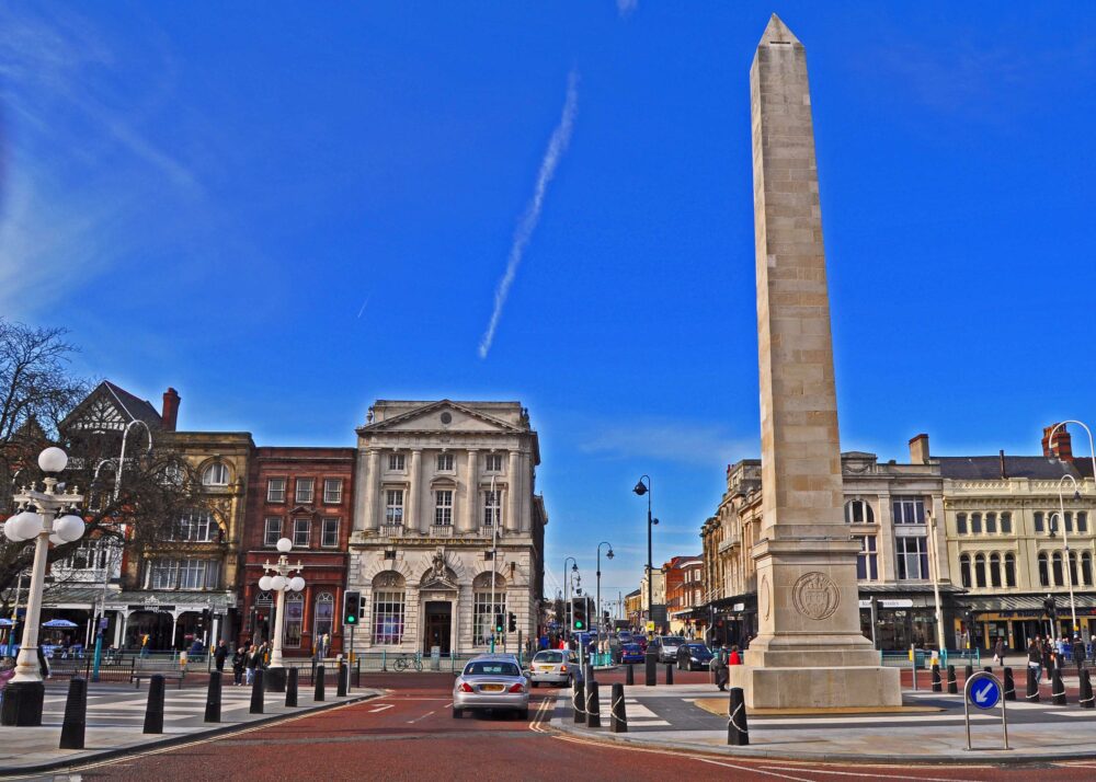Southport Town Centre showing the iconic obelisk against a blue Summer sky in Merseyside Uk